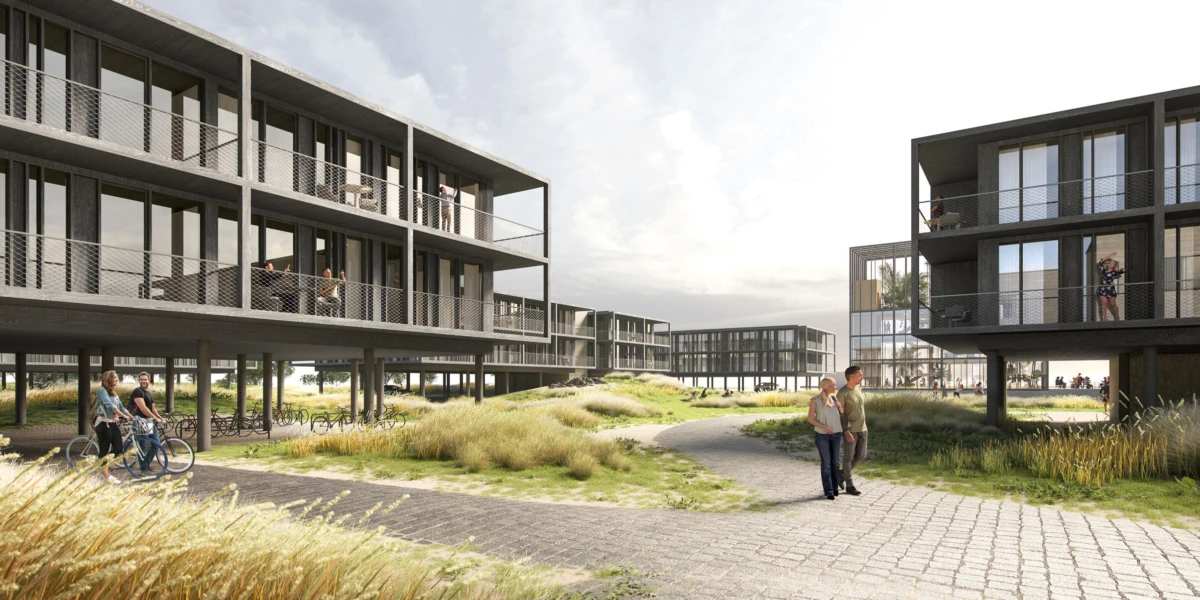 Modern elevated-apartment complex surrounding a grassy courtyard; people walk, cycle, and chat along paved paths.