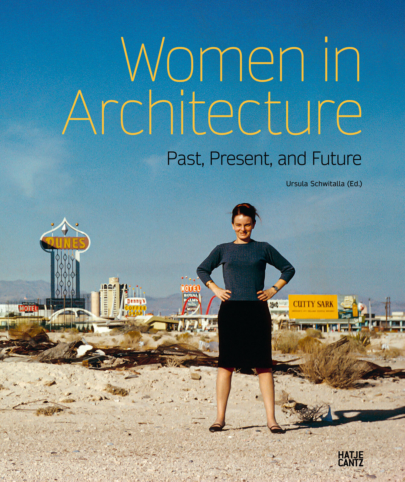 Book cover: person stands with hands on hips in a desert; title 'Women in Architecture'.