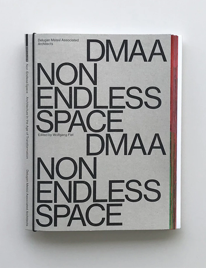 Hardcover design book lying flat on a white surface; bold cover reads 'DMAA NON ENDLESS SPACE'.
