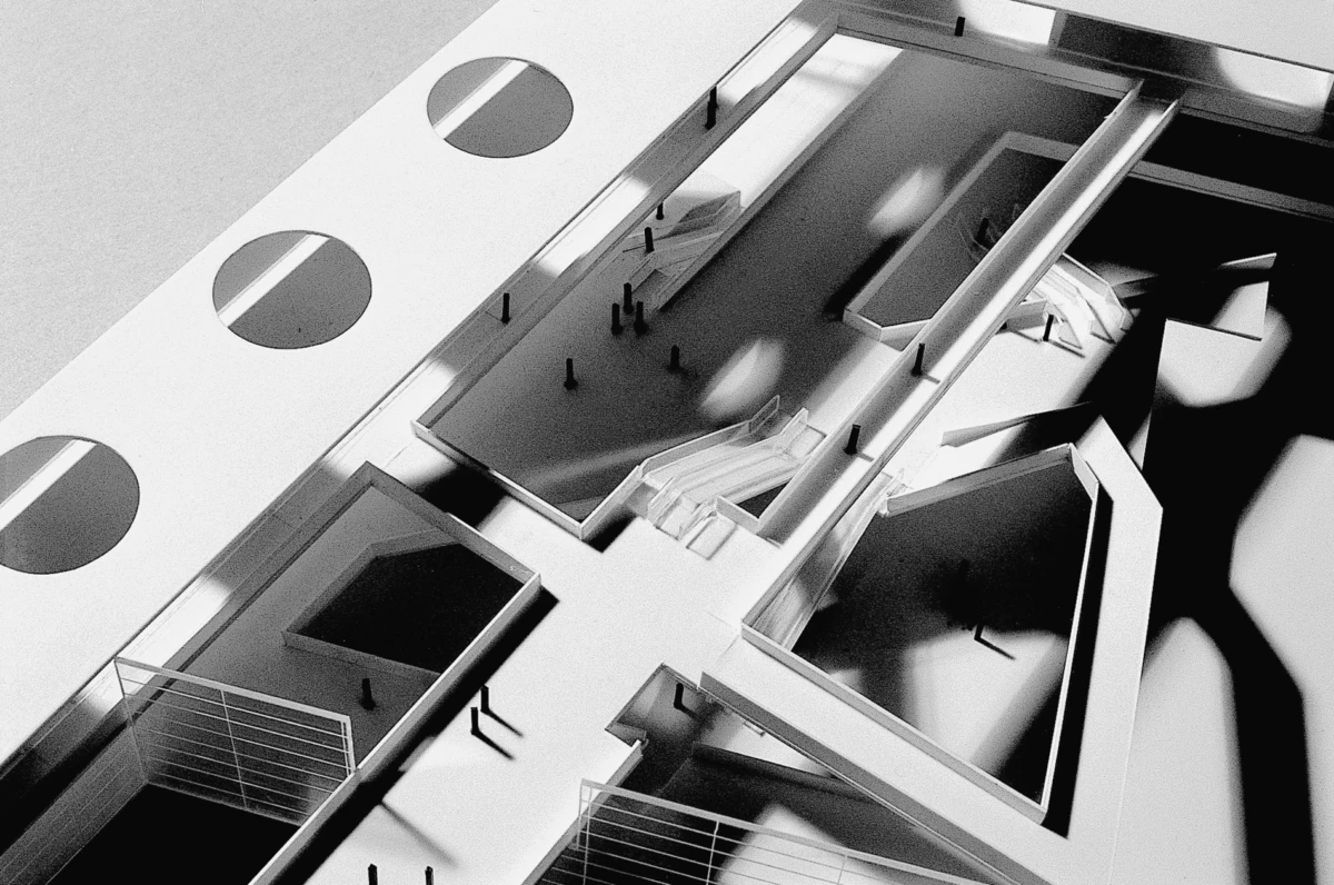 Isometric architectural model of a modern building interior with stairways and balconies.