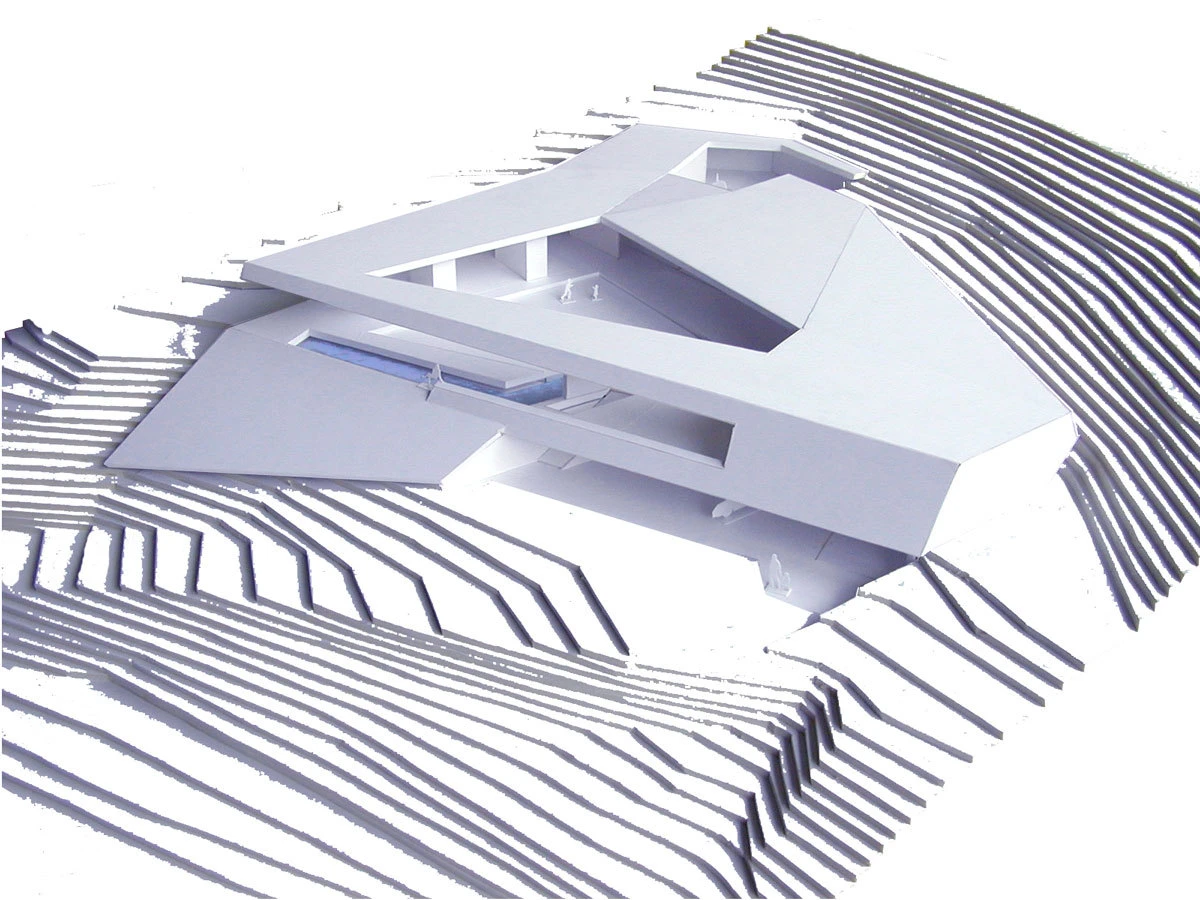3D architectural model of a modern building on a terraced topographic landscape.