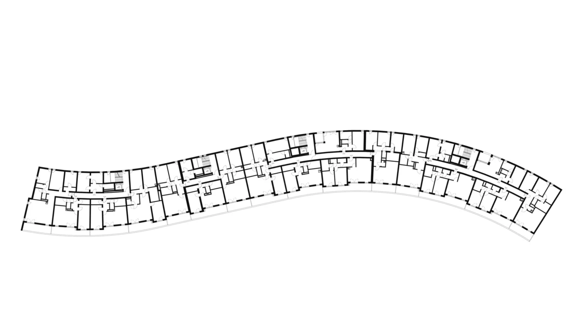 Curved architectural floor plan of a multi-unit building, showing a long central corridor flanked by numerous rooms.