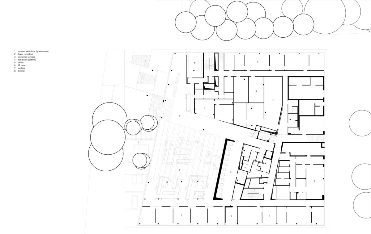 Architectural floor plan of a building with interior rooms and corridors, surrounded by circular tree symbols.