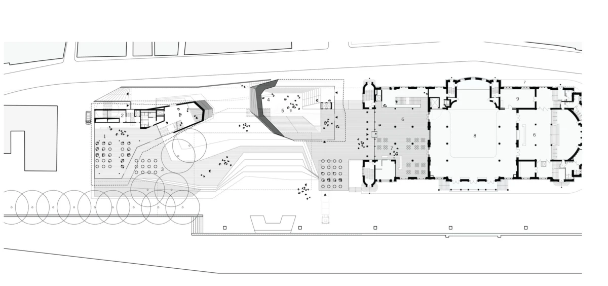 Top-down site plan: large rectangular building on the right, connected to a landscaped plaza with circular tree clusters, paths and terraces on left.