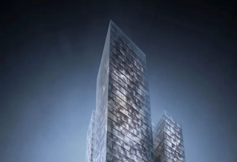 Two glass-clad high-rise buildings stand tall in a modern cityscape at dusk.