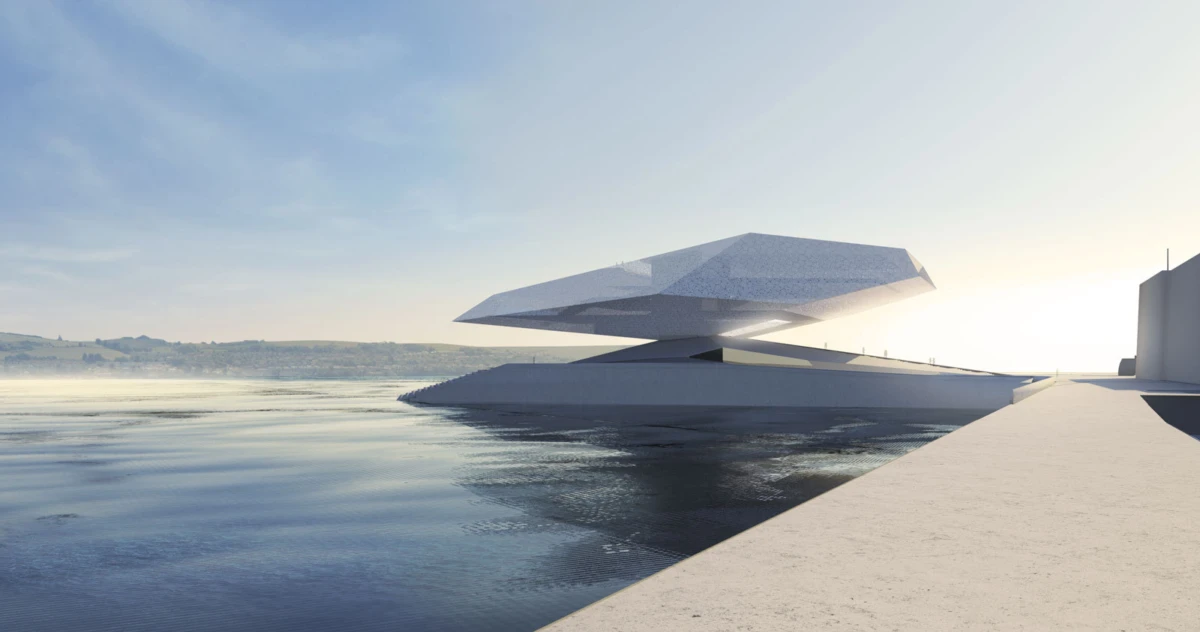 Cantilevered white pavilion extending over calm water from a concrete walkway at sunset.