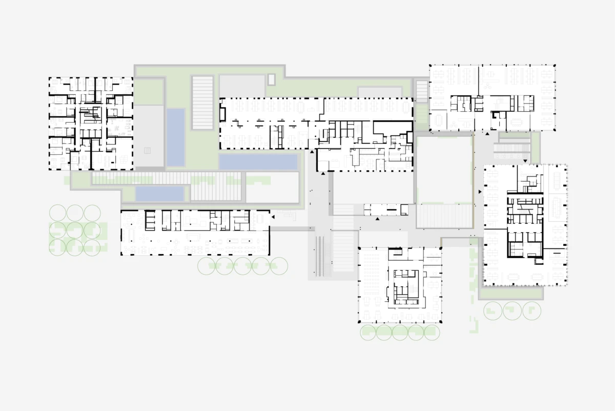 Top-down architectural floor plan of a multi-building complex with interconnected blocks and surrounding greenery.