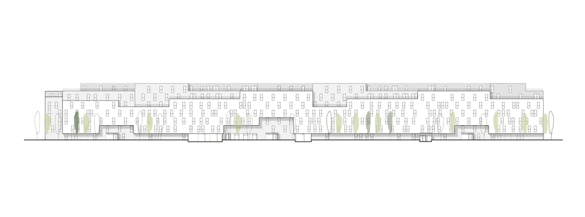 Long modern apartment building facade with numerous windows and a row of trees along the front.