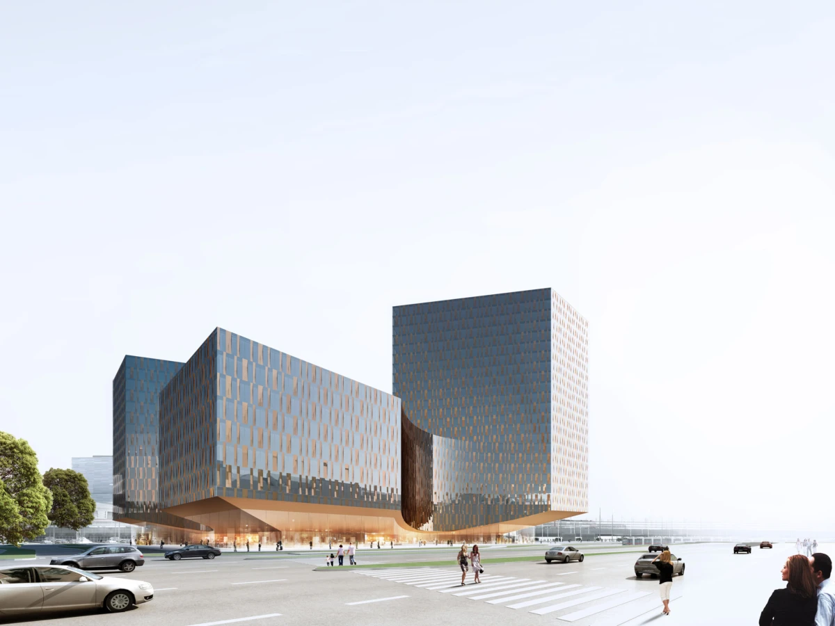 Modern glass-brick office complex with a curved connecting block; pedestrians cross a wide urban intersection.