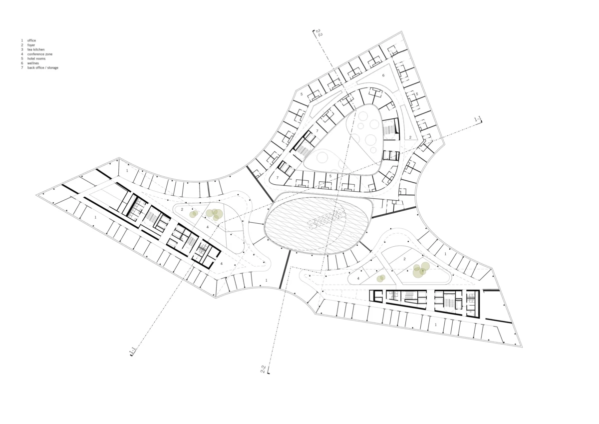 Top-down floor plan of a multi-wing building centered on an oval atrium, with curved corridors and perimeter offices.