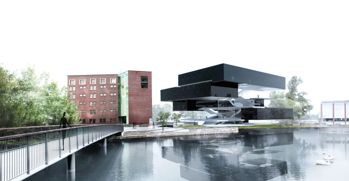Pedestrian on a bridge over a calm river toward a futuristic black, stacked building beside a brick multi-story structure.