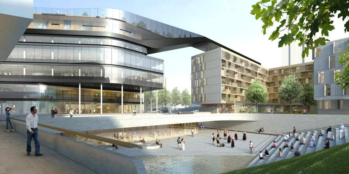 Modern glass office complex connected by an elevated pedestrian bridge over a sunlit plaza with a stepped water terrace and people strolling.