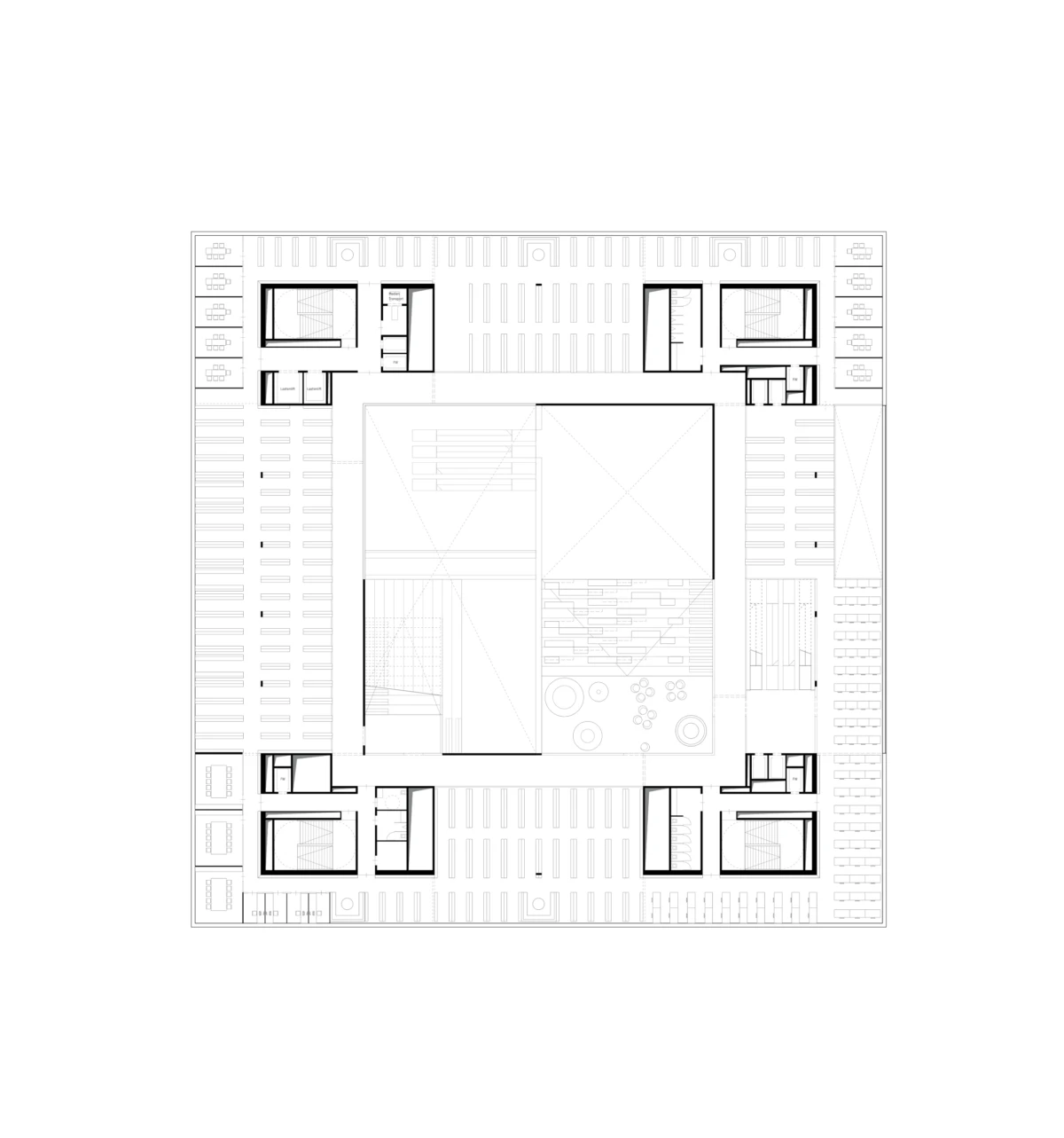 Architectural floor plan of a square building with central courtyard and surrounding perimeter parking.