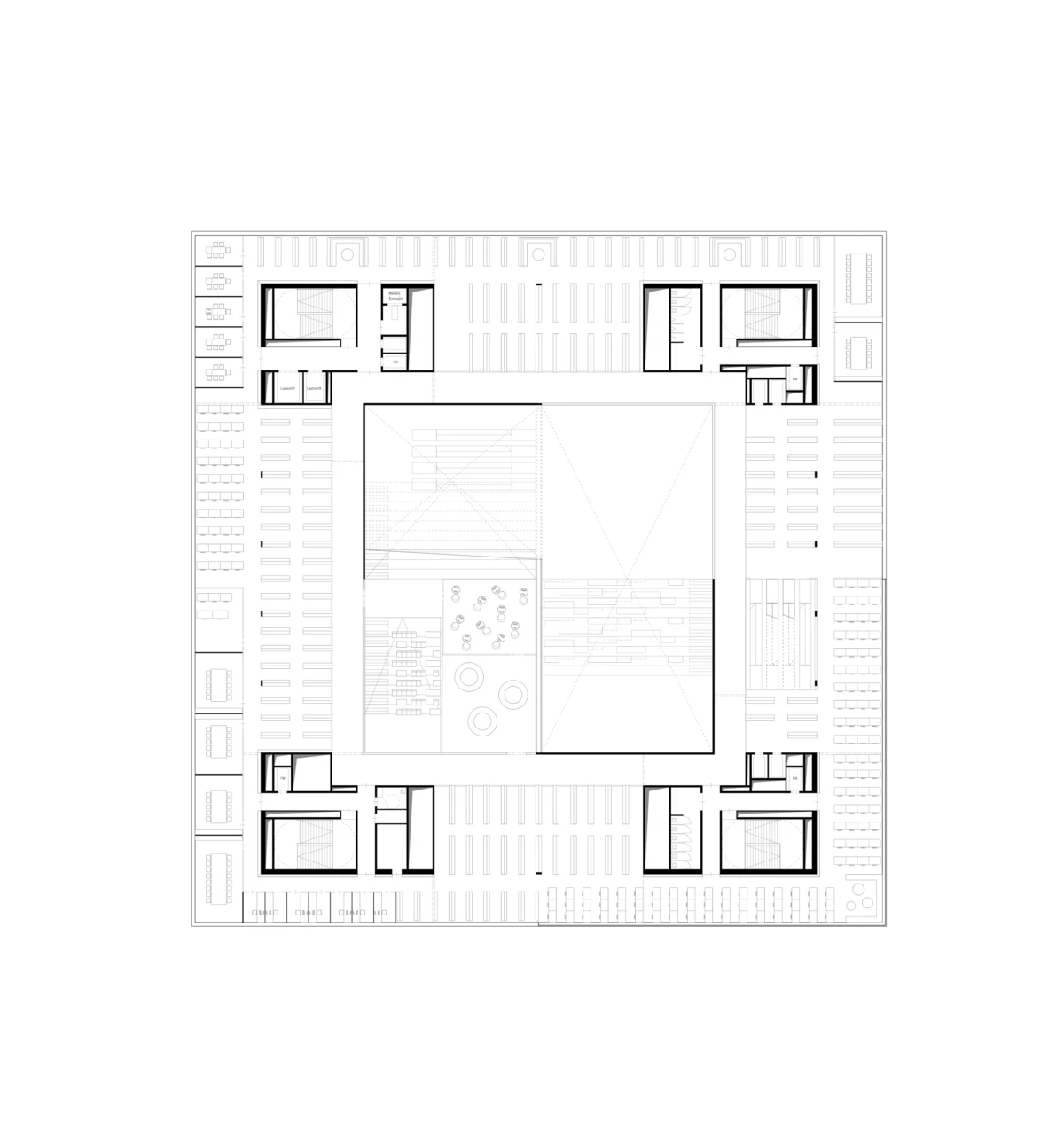 Square building floor plan with a central atrium, surrounding rooms and corridors, and outer parking stalls.