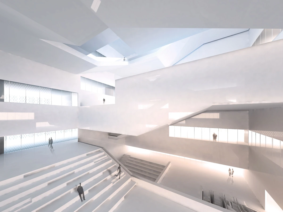 White minimalist interior atrium with broad stepped seating, elevated walkways, and glass walls; several people walk.