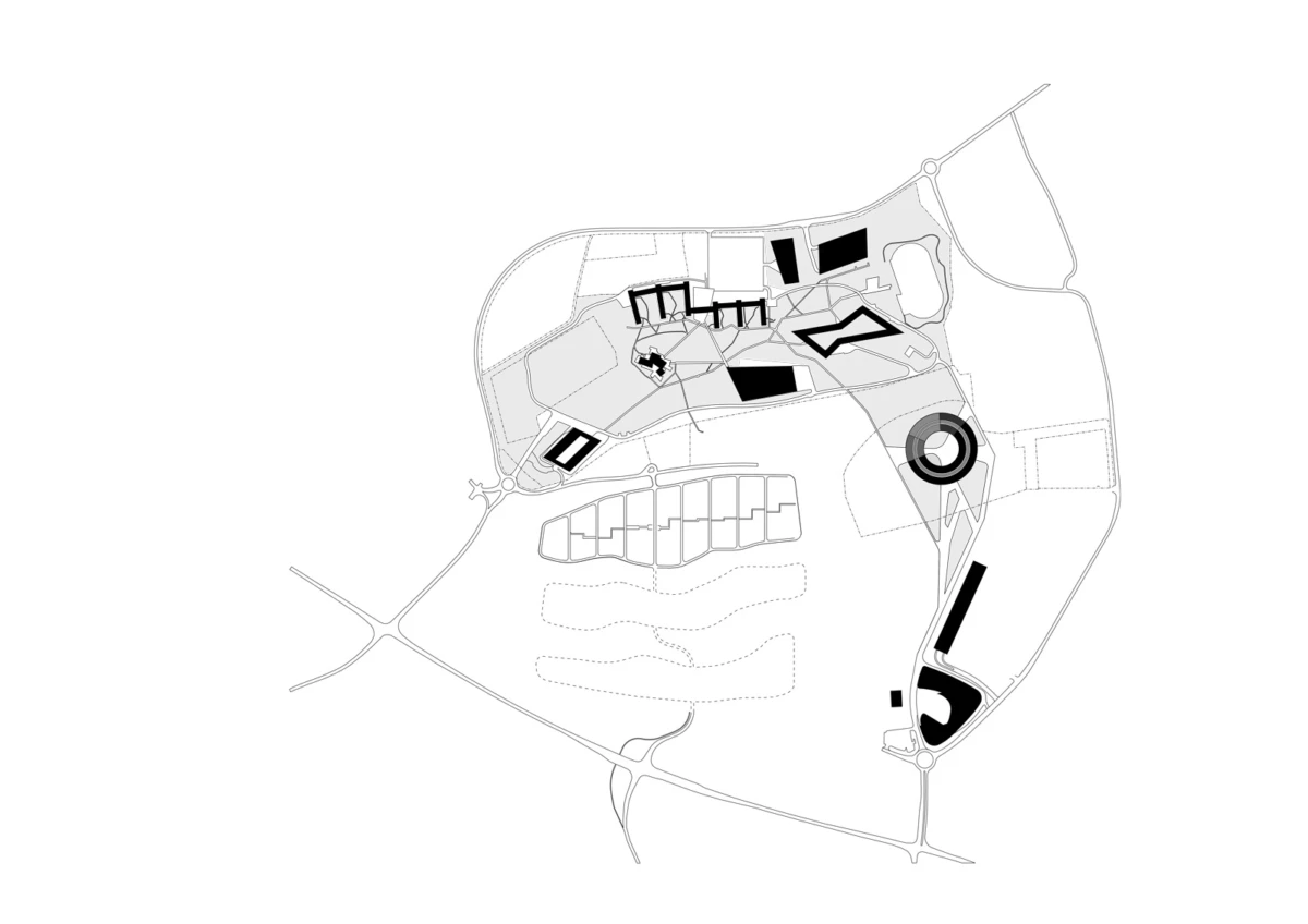 Schematic site plan of a park-like campus with roads, buildings, and a circular plaza.