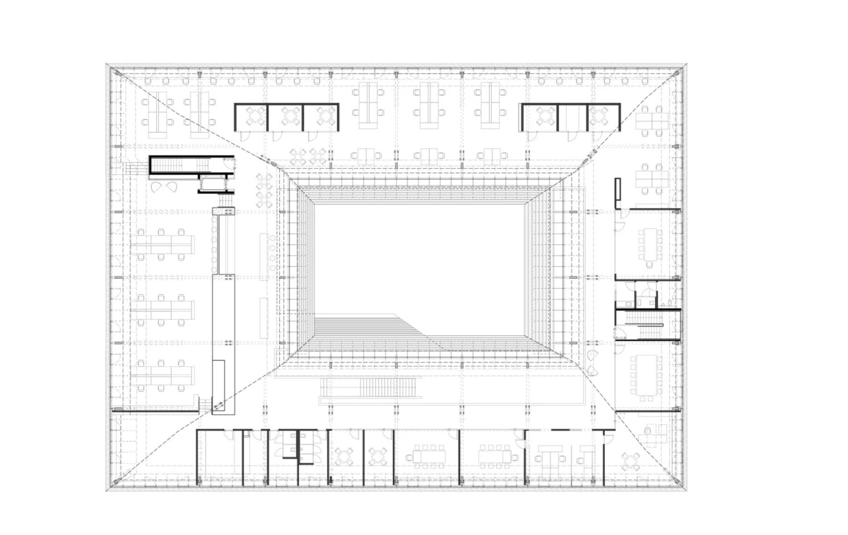 Rectangular building floor plan with a central square atrium, surrounded by offices and conference rooms.