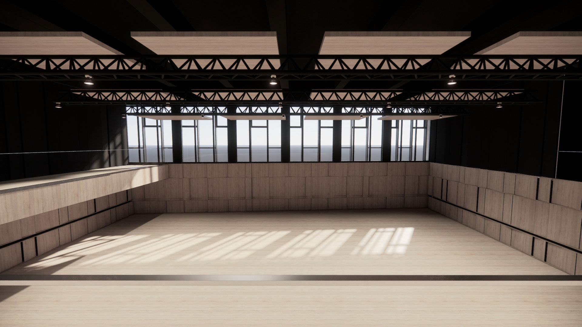 Empty industrial rehearsal hall with a wooden floor, concrete walls, and sunlit skylight shadows.