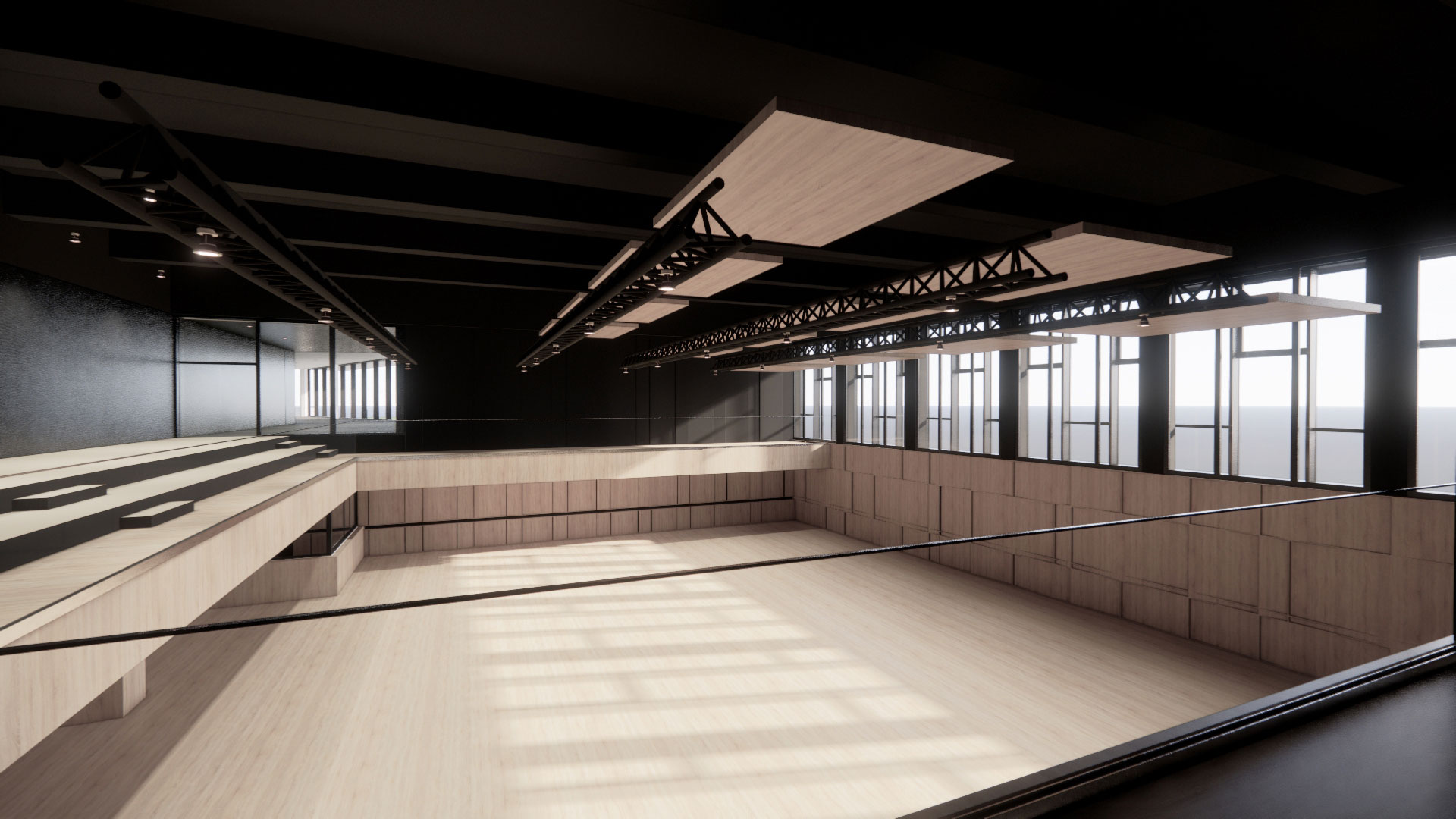 Empty modern dance studio with wooden floor, long bench seating along the left wall, and large windows on the right.
