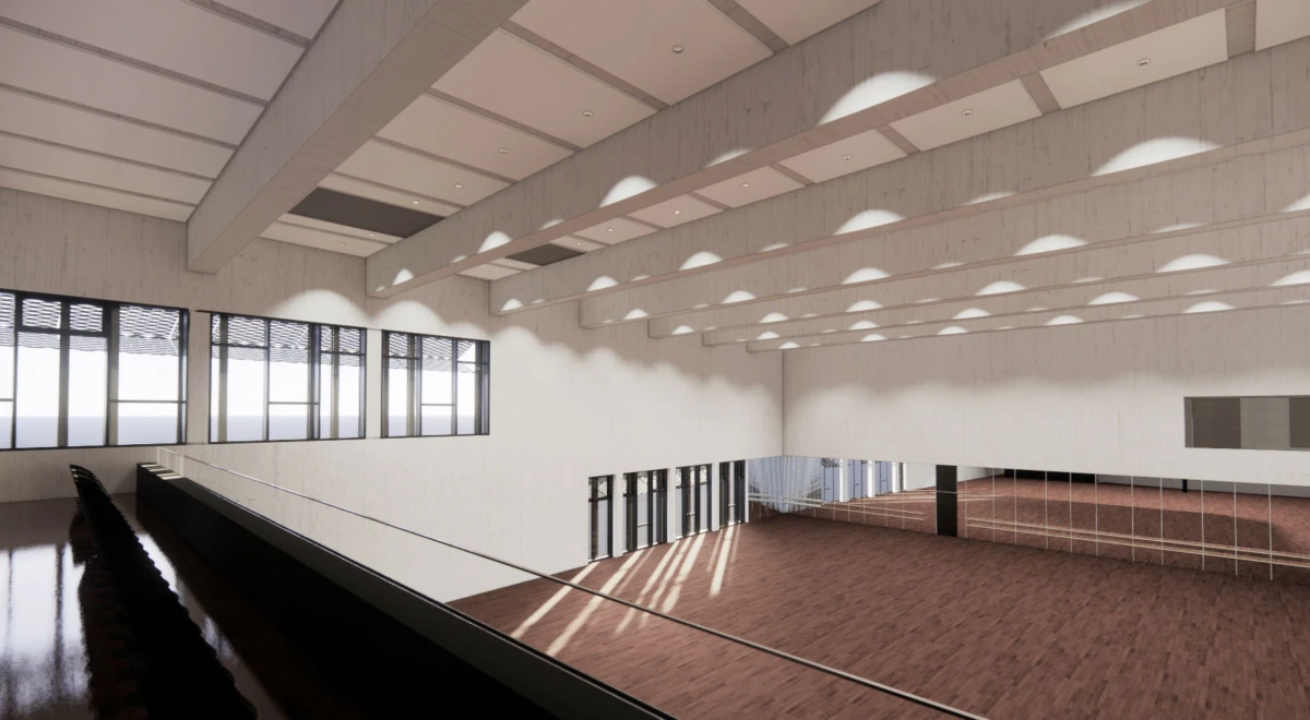 Empty modern atrium with mezzanine railing, glass doors and windows, brick floor, white walls, and circular skylights.