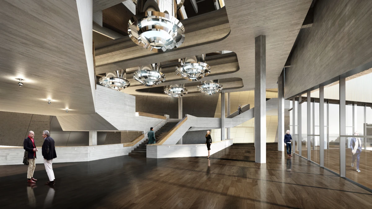 Two adults in business attire shake hands in a modern open lobby with curved white walls, stairs, and circular chandeliers.