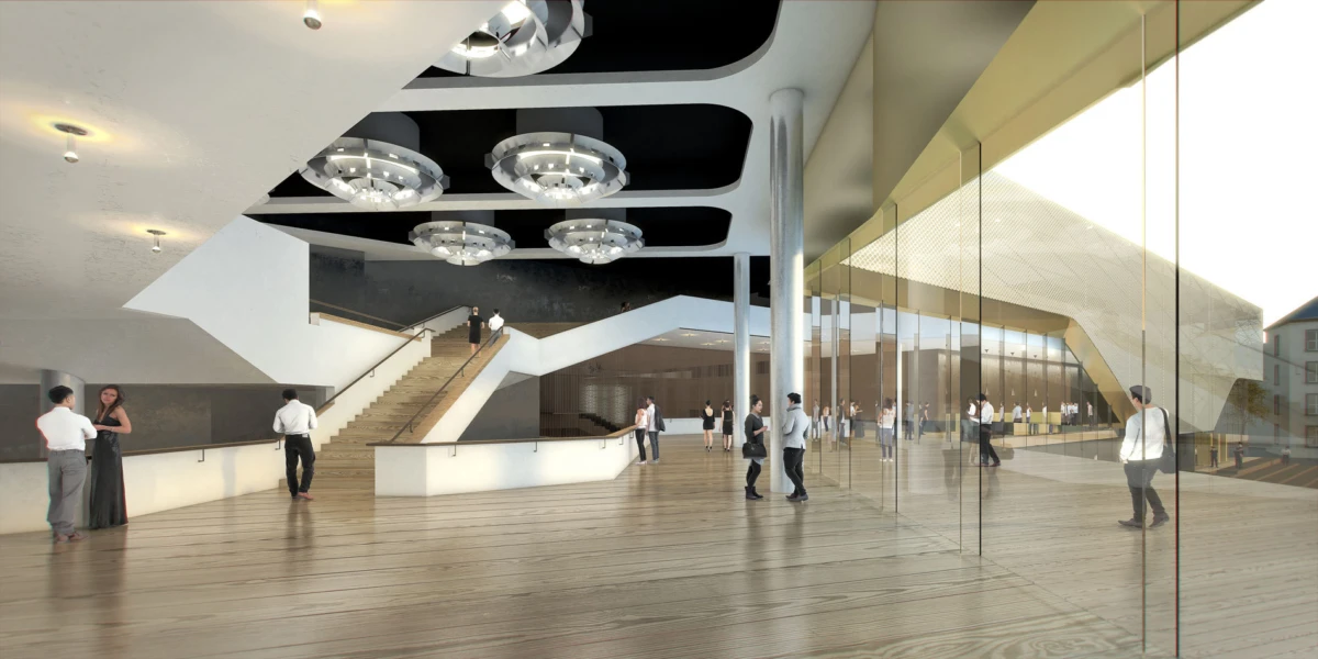 Contemporary atrium lobby with a wide staircase, circular ceiling lights, glass wall, and people walking.