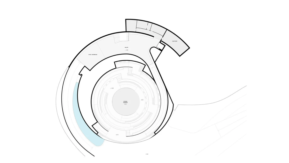 Top-down circular architectural floor plan with concentric rings and a curved outer extension; pale blue curved feature along the edge.