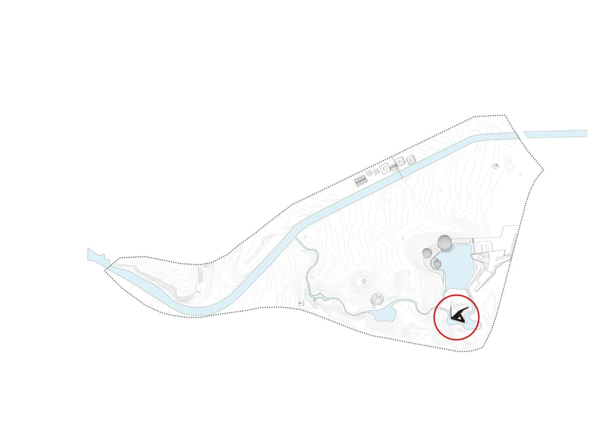 Site map of a park with a winding river, blue water features, and a circled black marker near the southeast edge.