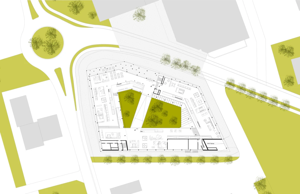 Aerial site plan of a triangular building with inner courtyards, surrounding roads, and landscaped green spaces.