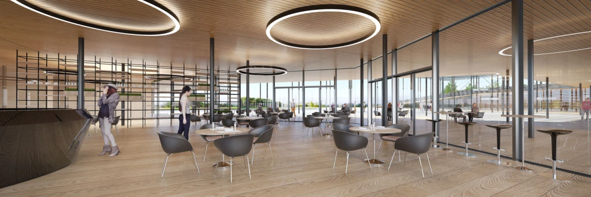 People in a modern open-concept cafe lounge with circular ceiling lights and glass walls; some stand and chat.