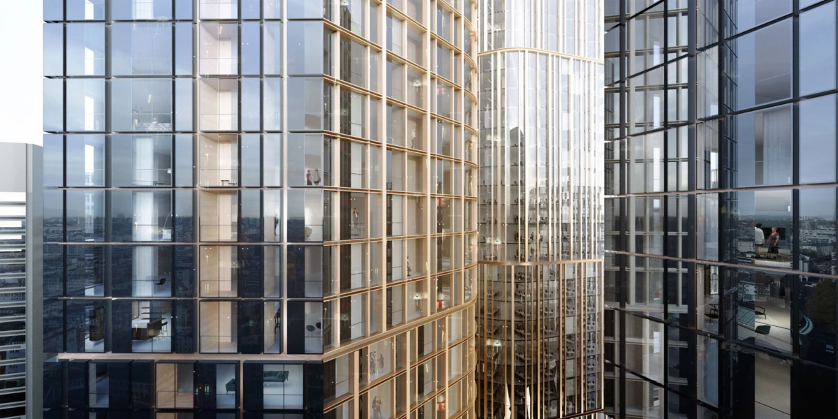 Between glass skyscrapers, a narrow urban canyon reflects the surrounding city.