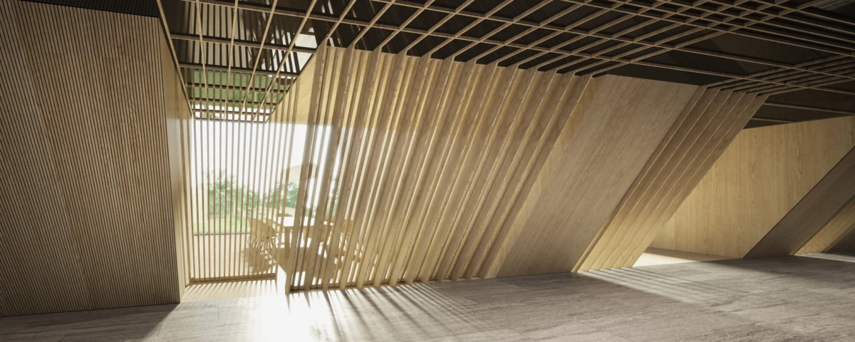 Interior of a modern wooden pavilion with diagonal slat walls and a sunlit open doorway to outdoors.