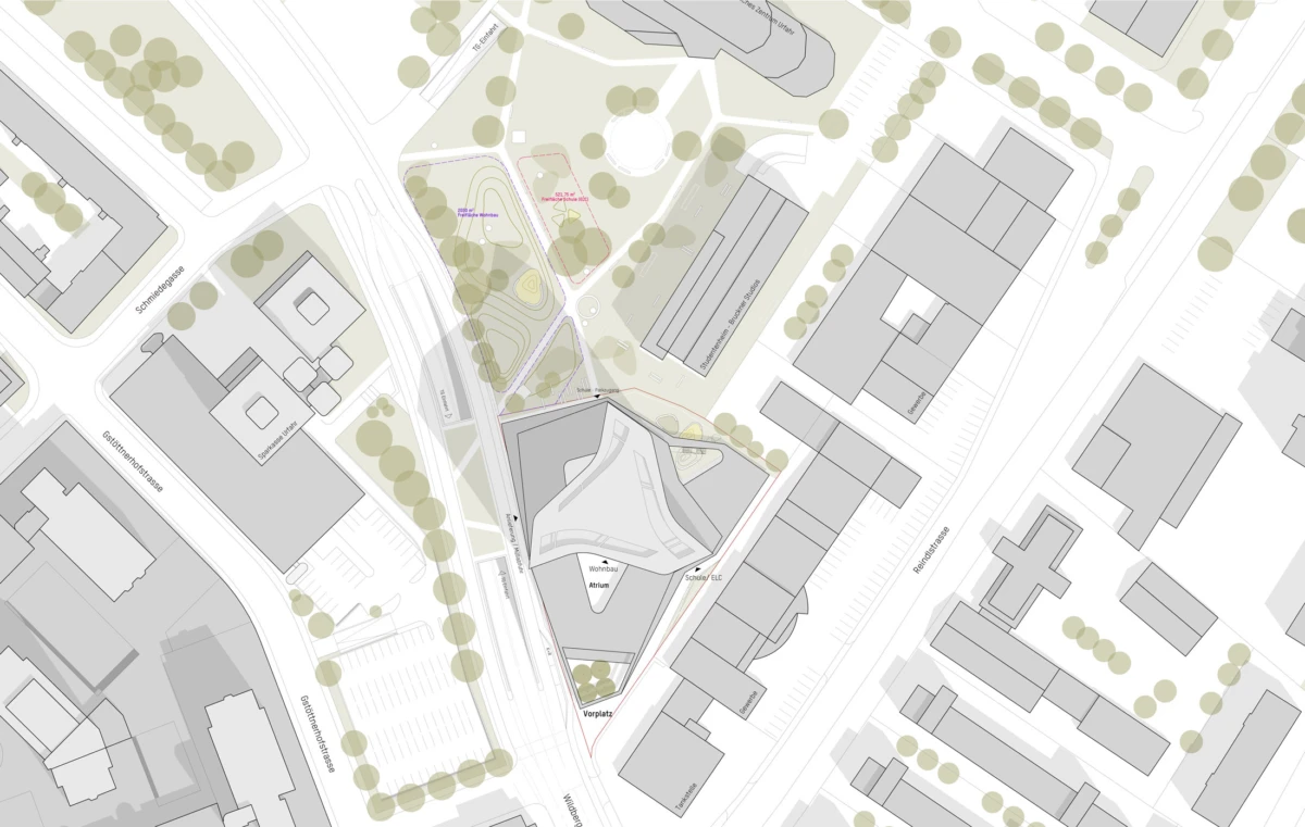Triangular urban development site outlined in red, featuring a modern multi-wing building, surrounding streets, a western rail line, and a nearby park.