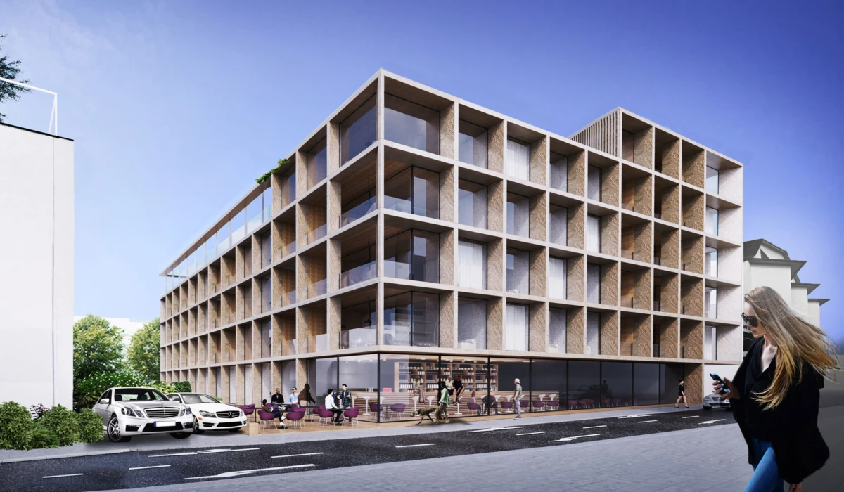 Modern four-story office building with a square lattice concrete facade; outdoor cafe seating, pedestrians, and parked cars on an urban street.