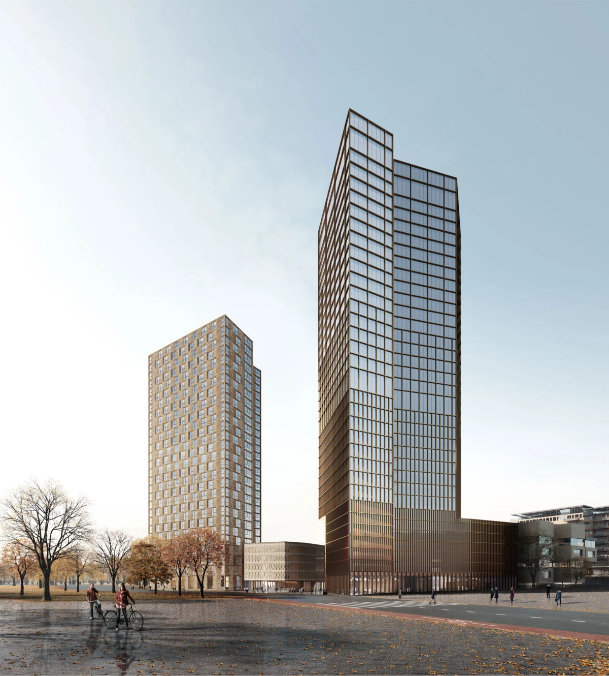 Two glass-clad skyscrapers rise over a paved plaza; pedestrians and cyclists on a street beside autumn trees.
