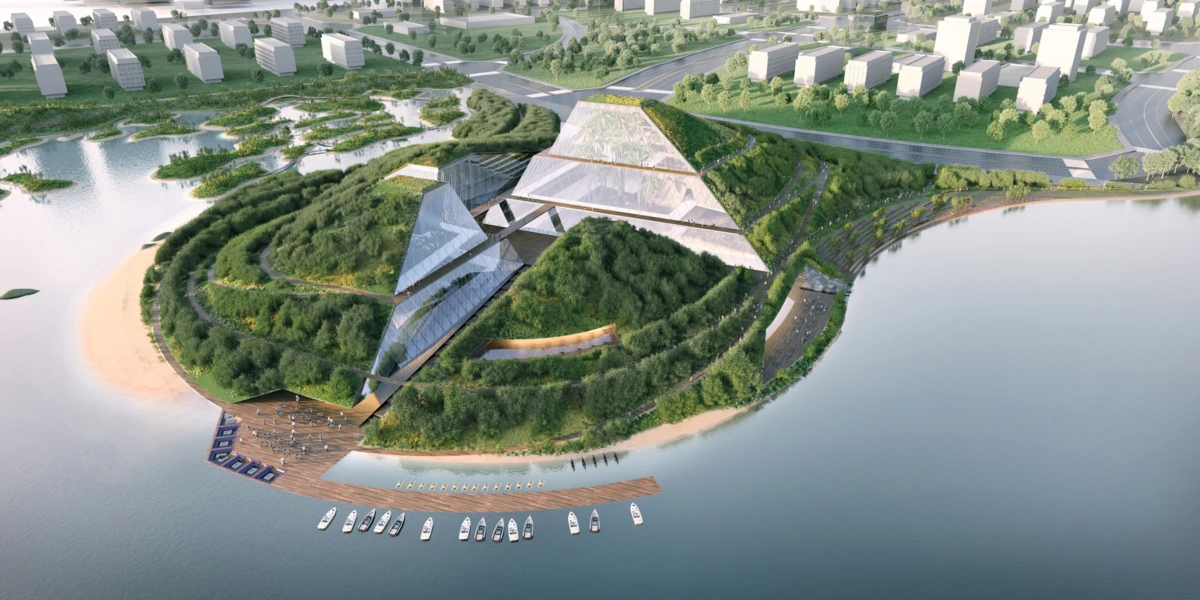 Terraced green hillside island with a glass pyramid pavilion, adjacent marina with boats, sandy beach, and distant cityscape.