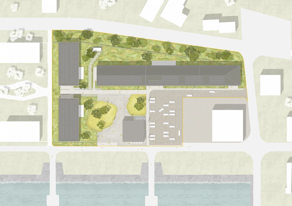Aerial site plan showing a mixed-use campus with two vertical building blocks, a long central building, parking, green space, and a riverfront edge.