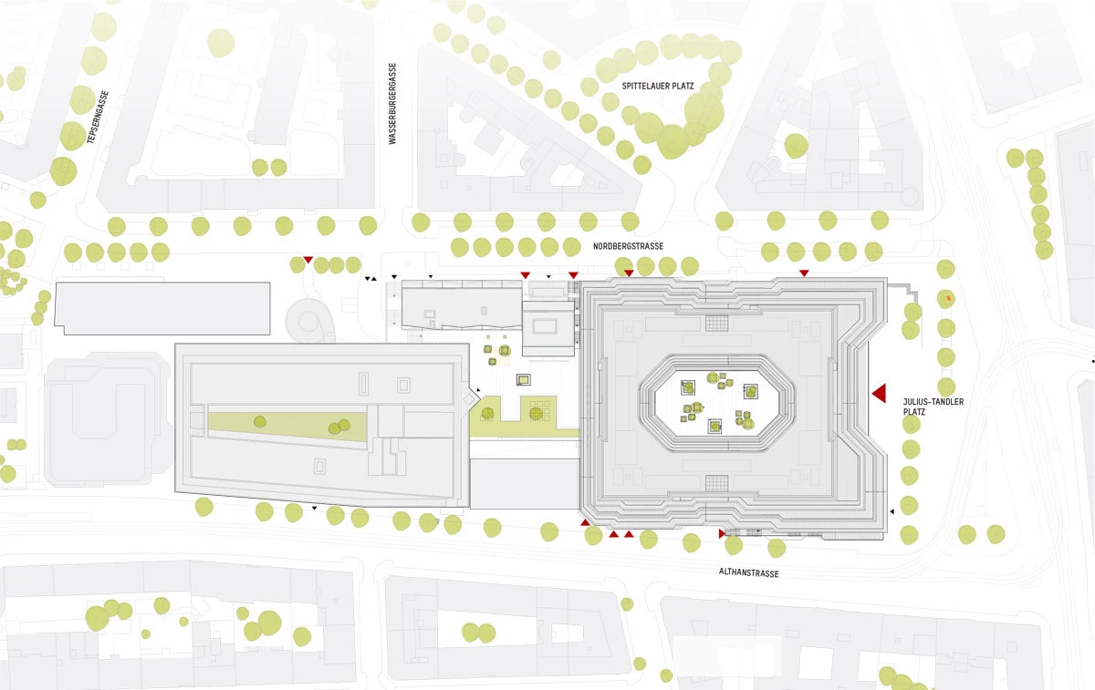 Top-down plan of a large square building complex with a central octagonal courtyard, surrounded by tree-lined streets and smaller annexes.