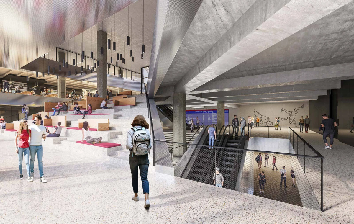 Person with backpack walking through a modern atrium with tiered seating and escalators.