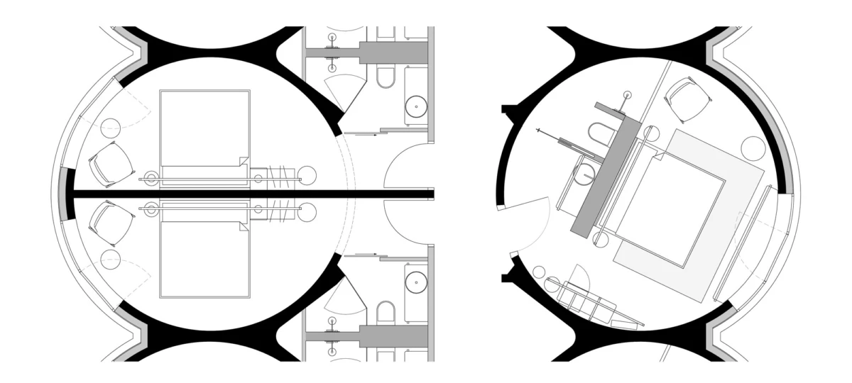 Top-down floor plan of two circular living pods connected by a hallway, showing beds, desks, chairs, and built-in fixtures.