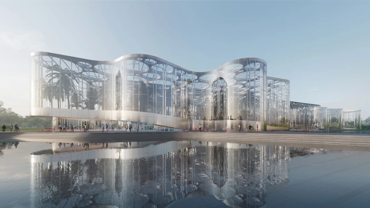 Modern glass building with a curved, wavy facade, palm trees inside, and pedestrians along a reflective pool.