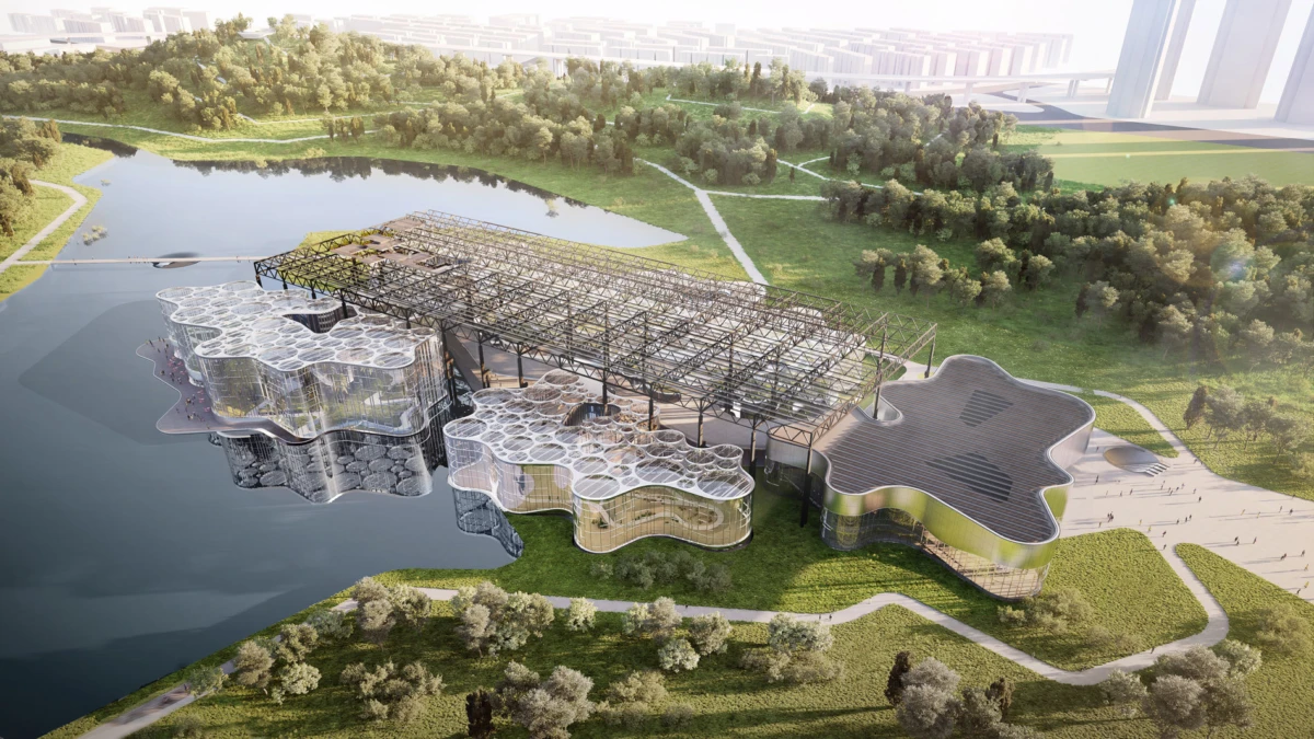 Futuristic organic-shaped architectural complex on a lake, connected by lattice canopy to a curved building, surrounded by grassy park and trees.