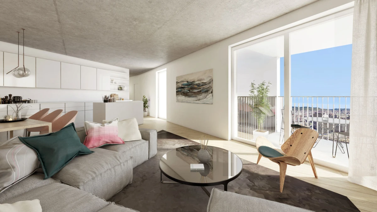Modern open-plan living room with gray sectional sofa, glass round coffee table, wooden chair, and balcony overlooking city and sea.