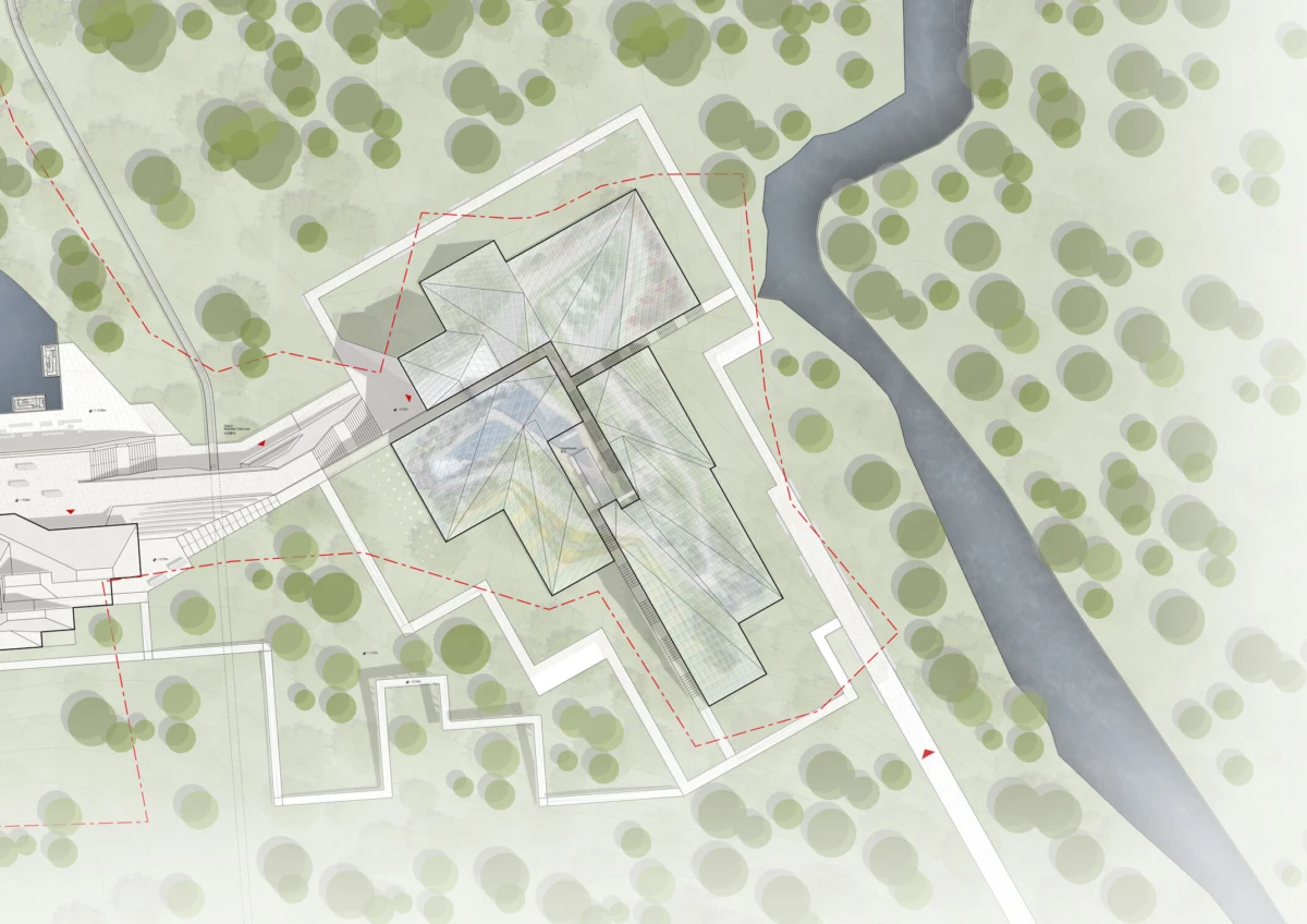 Top-down site plan of a multi-wing building with angular roofs, surrounded by trees; a river lies to the right with red dashed circulation paths.