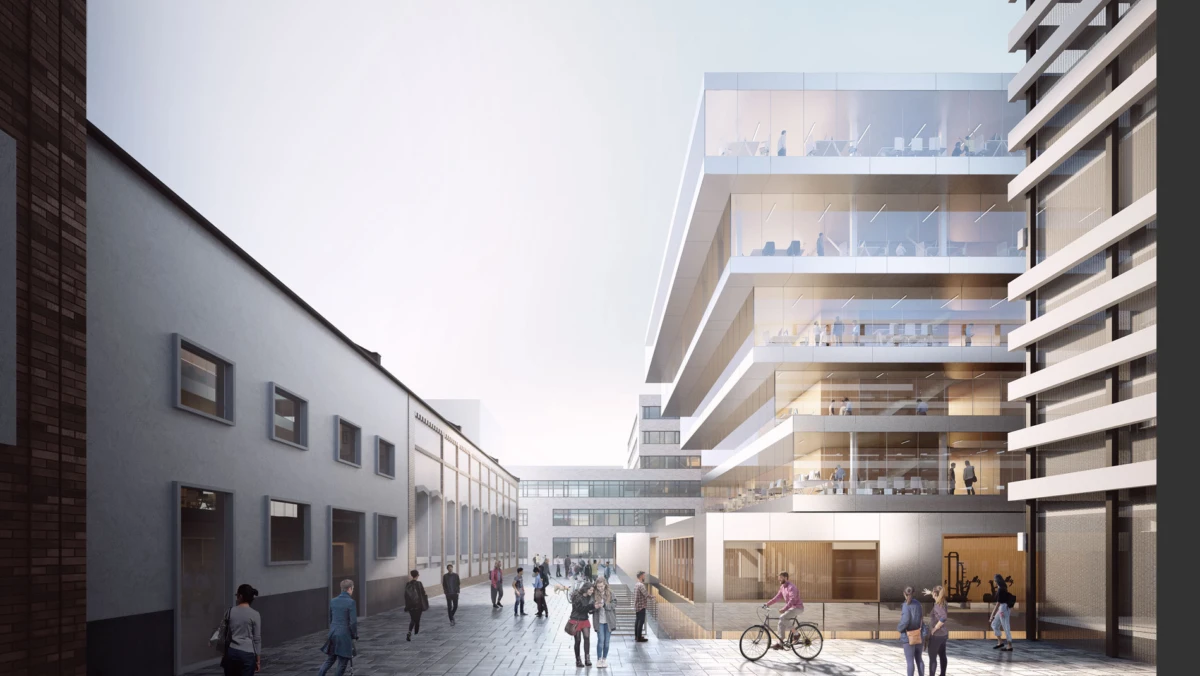 Sunlit urban plaza with a modern glass-clad office building featuring stacked terraces on the right; pedestrians and a cyclist.