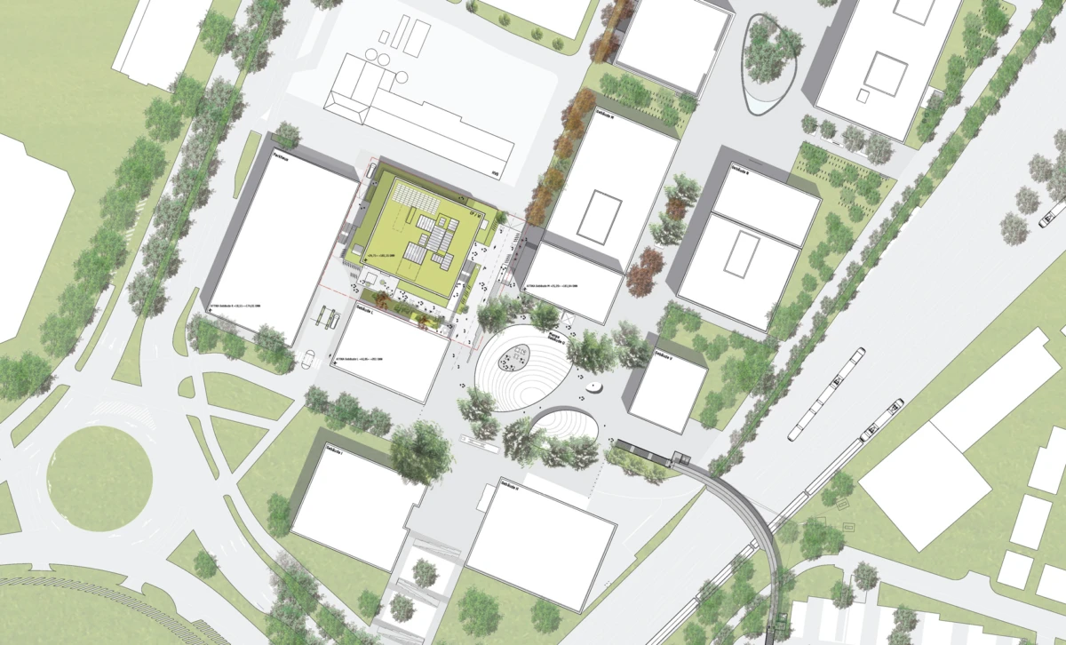 Aerial site plan of an urban campus with rectangular buildings around a central circular plaza and tree-lined streets