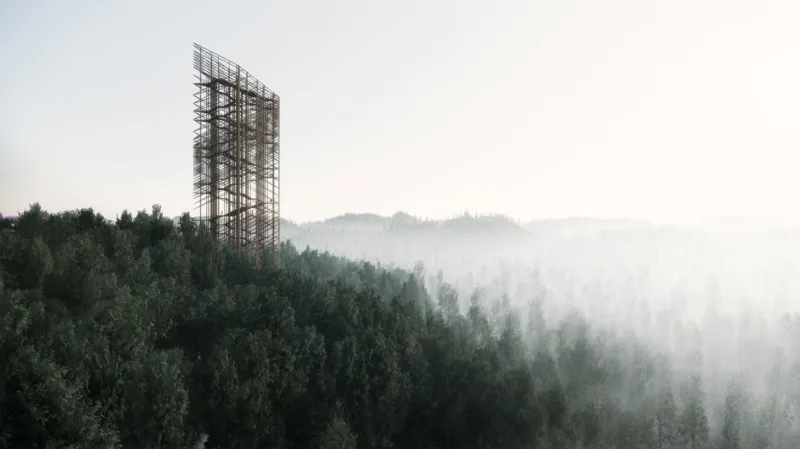 Metal lattice tower rising above dense forest as morning fog rolls over the trees.