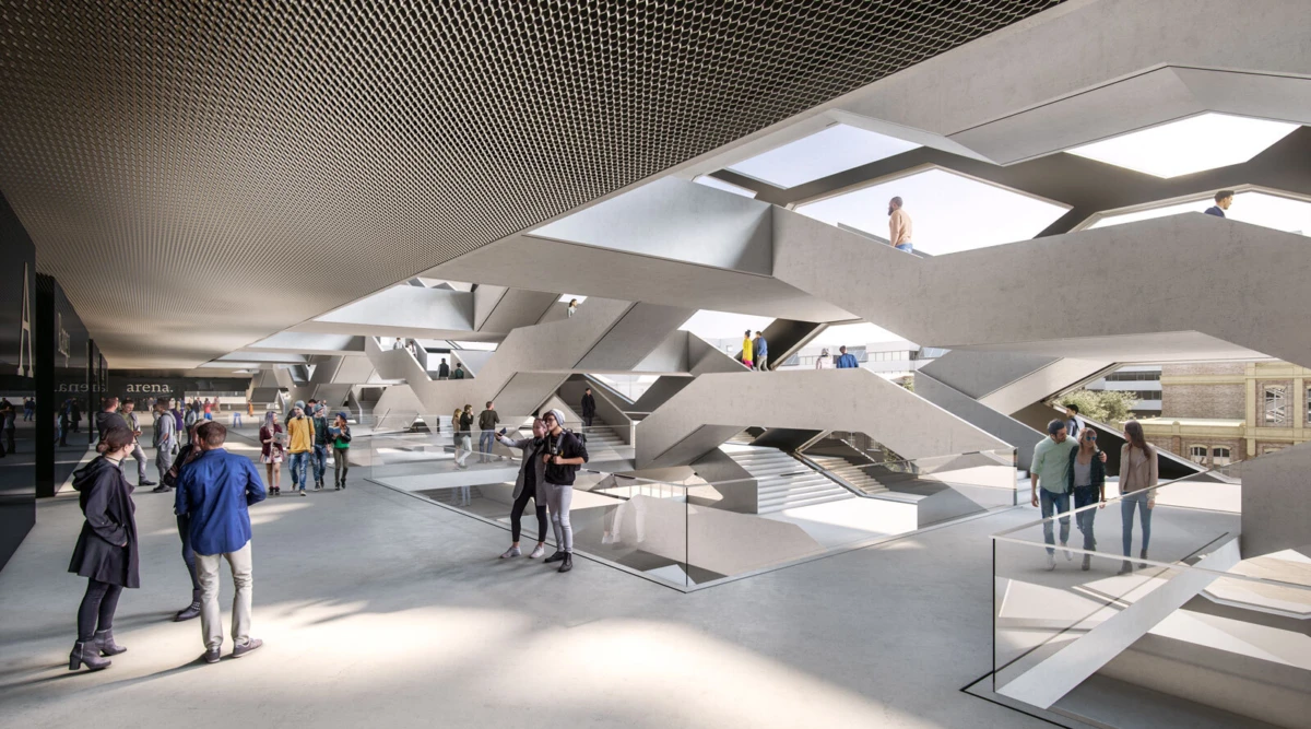 Modern, multi-level interior with crisscrossing concrete stairways and glass railings; groups of pedestrians walk and converse.