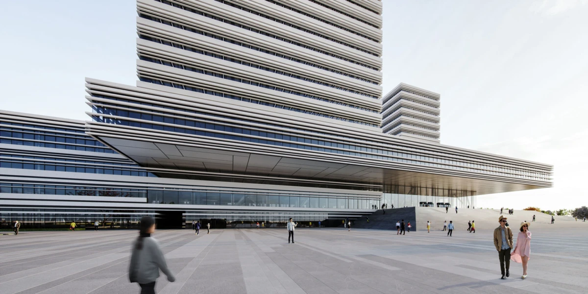 Contemporary multi-tiered building with glass facade; people walk across a wide plaza in front.