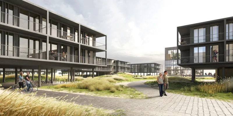 Modern elevated-apartment complex surrounding a grassy courtyard; people walk, cycle, and chat along paved paths.